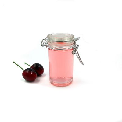 Wholesales clear 70ml tall glass food storage jar with stainless steel lid