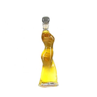 Customize bottling different capacity body shaped glass bottle packaging 