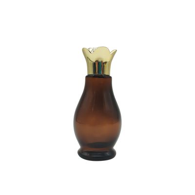 china factory wholesale 50ml cosmetic packaging glass essential oil bottle with gold UV cap inner plug