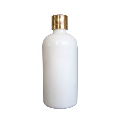 empty packaging containers essential oil bottle round ceramic lotion bottles 100ml white glass cosmetic bottle with gold cap