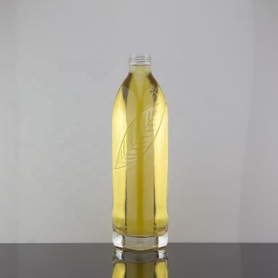 Custom Shape Screw Cap Sealed Beverage Glass Bottle 500ml With Embossed Leaf Pattern 