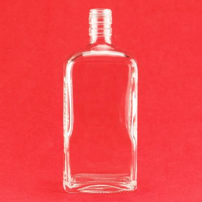 Custom Design Super Flint Glass Bottle Flat Shape Embossed Side Brandy Whisky Liquor Bottle With Screw Cap 