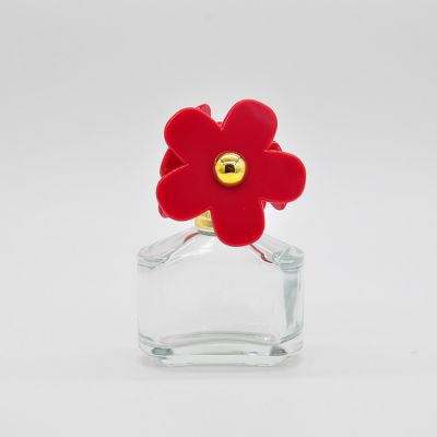 30ml empty high quality OEM wholesale design transparent glass perfume bottle with flower cap 