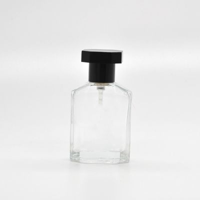 25ml Empty high quality special shape transparent OEM glass perfume bottle with pump sprayer black cap 