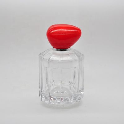 100 ml Empty high quality transparent OEM glass perfume bottle with mist sprayer red stone cap 