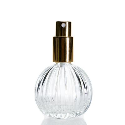 Custom Refillable 50ml Round Ball Shaped Embossed Crystal Glass Spray Perfume Bottles