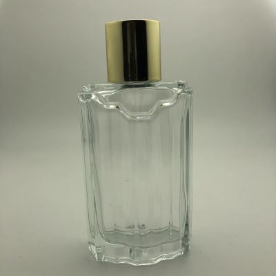 Embossed 100ml perfume glass bottle with PP cap