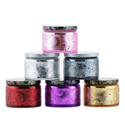 Colorful luxury embossed empty glass container candle jar with lid for home decoration