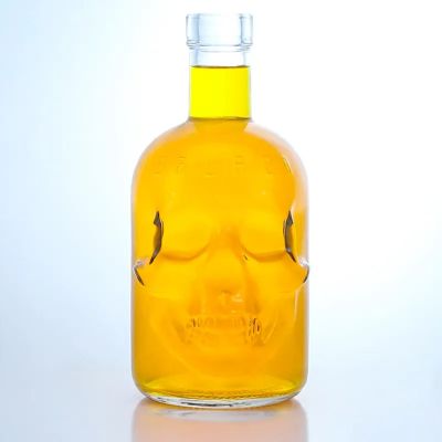 Customized shape skull 700ml 750ml clear vodka rum liquor glass bottle with screw cap