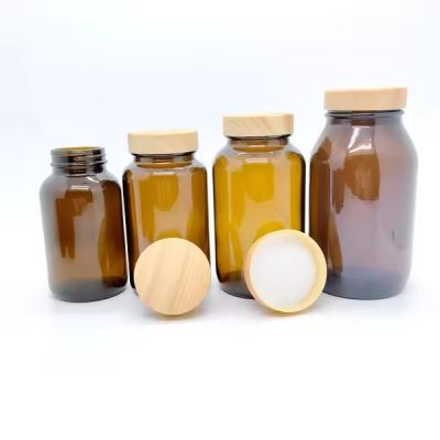 Recyclable vitamin tablet bottle packaging 60ml 100ml 120ml 150ml wide mouth amber glass capsule bottle with wooden bamboo lid