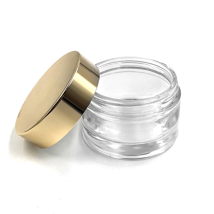 Big size empty cosmetic packing custom 180g clear glass cosmetic jar with uv gold plastic lid