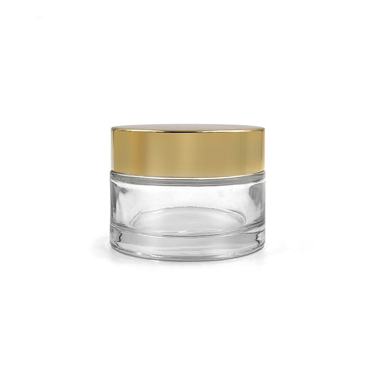 Big size empty cosmetic packing custom 180g clear glass cosmetic jar with uv gold plastic lid