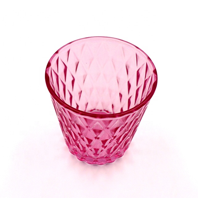 Diamond shaped translucent red cone candle glass jar