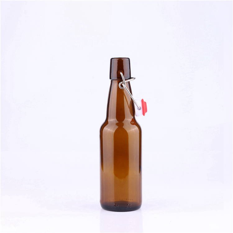 Stocked long neck 300 ml transparent amber empty glass beer bottle with swing lid