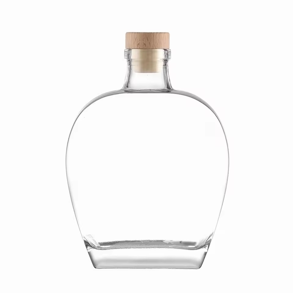 Customized 500ml Transparent Round Hollow Flint Glass Whiskey Bottle with Rubber Cork Stopper for Brandy Wine Vodka Tequila