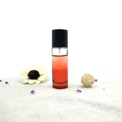 Simple design 30 ml round glass perfume bottle with black cap 