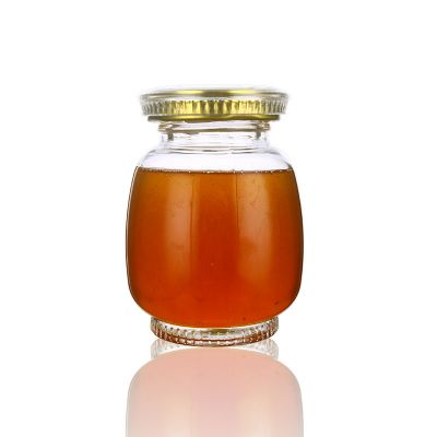 Wholesale decorative 750ml 26oz round honeycomb honey pot clear glass jar price 