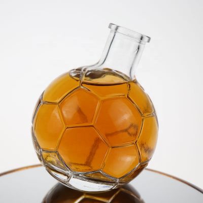 Small size customized football shape glass liquor bottle with cork 