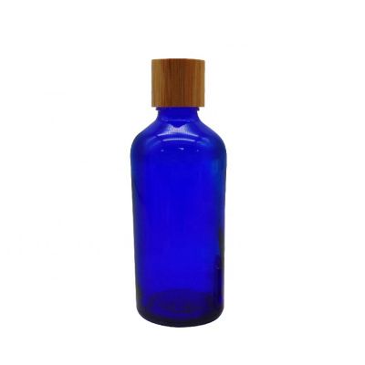 Custom 100ml Round Blue Airtight Glass Bottles Esseontial Oil with Bamboo Wooden Lid 
