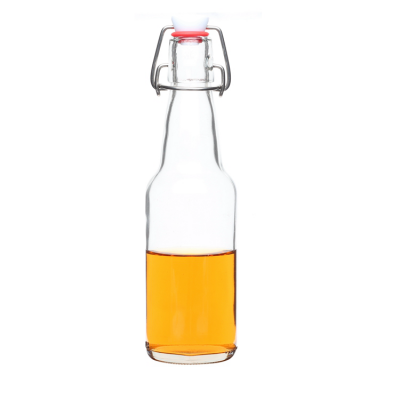 Wholesale custom logo sealed empty clear 330ml beer kombucha glass bottles with swing top 
