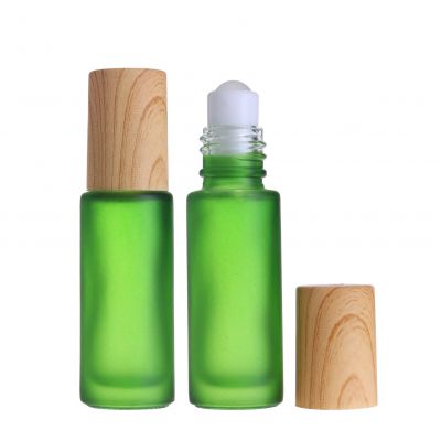 Mini travel empty custom 5ml green roll on glass perfume bottle with stainless roller ball for eye cream