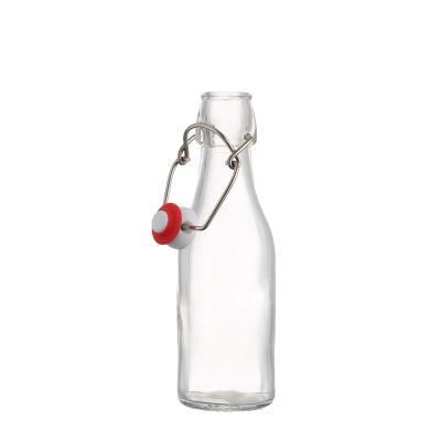 Stocked high quality good price 250 ml clear empty glass beer bottle with swing top 