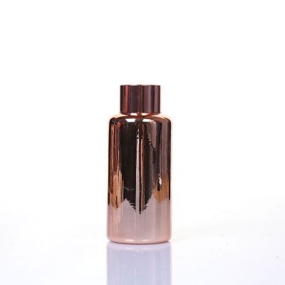 Wholesale Rose Gold 100ml Cylindrical Glass Aromatherapy Reed Diffuser Bottle With Cap 