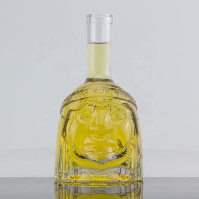Custom Design Long Neck Embossed Face Shape Whisky Glass Bottle 500ml Cork Sealed 