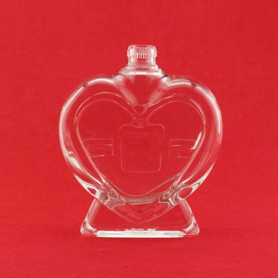 Wholesale Latest Design Heart Shape Unique Shaped Whisky Empty Glass Bottles With Screw Cap 