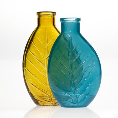 Factory new custom design 100ml leaf shaped glass aroma reed diffuser bottle with cork
