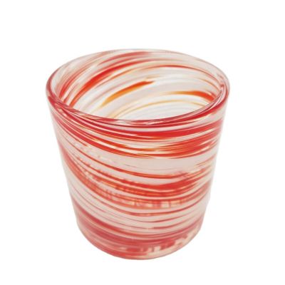 Swirled red and white glass jar for candle making
