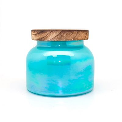 colored glass candle holder with wooden lid