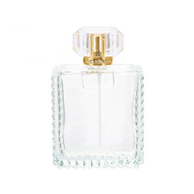 New design 100ml clear square crystal perfume glass bottle packaging with gold aluminum mist sprayer and acrylic cap