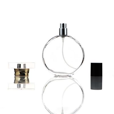Clear 100ml oblate round perfume bottle glass atomiser bottles with crimp spray pump
