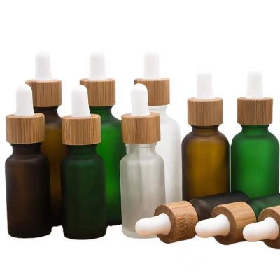 Hot sale 10ml15ml20ml30ml50ml100mlFrosted Green Blue Amber Clear Essential Oil Dropper Bottle With Bamboo Lid