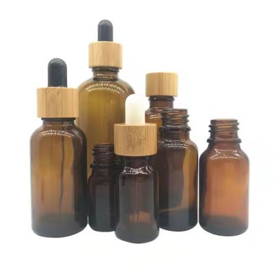 empty 30 ml 1 oz cosmetic essential hair oil bottles cuticle frosted black glass dropper bottle with bamboo lid top for cbd