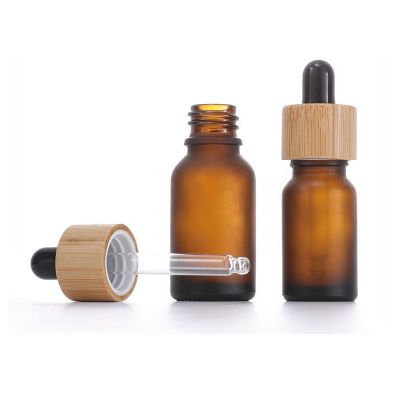 Empty 30 ml 1 oz cosmetic essential hair oil bottles 30ml cuticle frosted amber glass dropper bottle with bamboo lid top for cbd