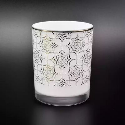 white glossy candle jar with gold rim and pattern