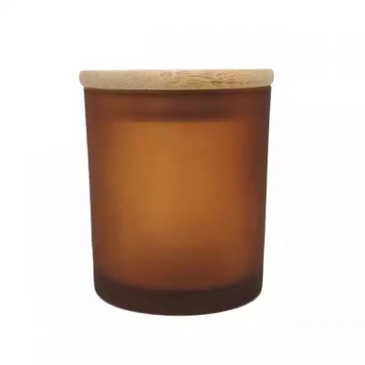 Factory wholesale amber frosted glass jars with bamboo lids can be used as wedding decorations