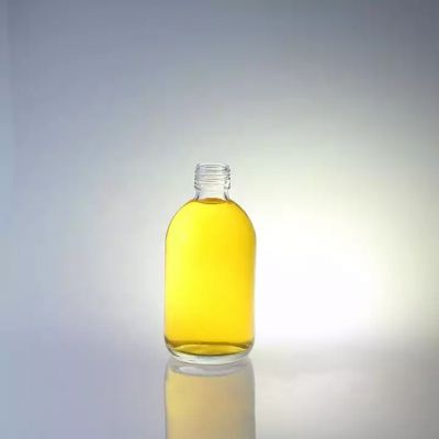 Factory Wholesale Super Flint Glass 700ml 750ml Clear Round Shape Whisky Liquor Glass Bottle With Cap Manufacturer