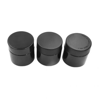 Wholesale 2oz glossy black Round herb flower packaging straight side glass bottles with screw childproof lids