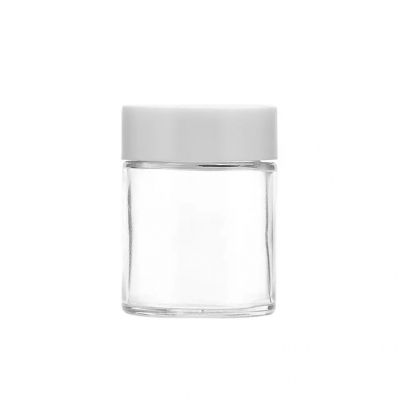 Wholesale 2 oz clear Round flower jar packaging glass bottles with screw childproof caps