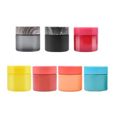 Hot sale fancy 70ml customized color cosmetic cream empty packaging wide mouth straight side flower glass jar with CR lid