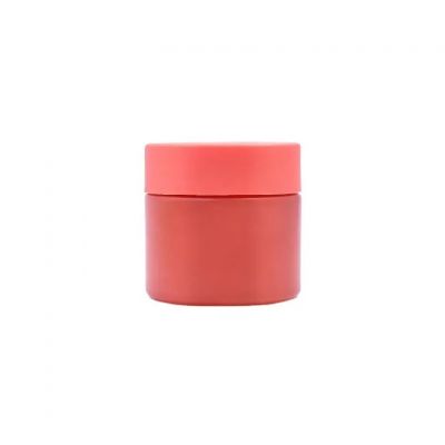 Hot sale fancy 70ml orange cosmetic cream wide mouth glossy flower glass jar with childproof lid