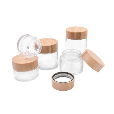 wholesale different size 25ml 55ml 75ml 110ml 170ml clear transparent child resistant child proof glass jar with bamboo lid