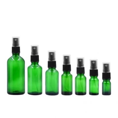 [ 复制 ]Wholesale different specifications amber green recycled liquid Essential oil glass bottles with plastic sprayer head