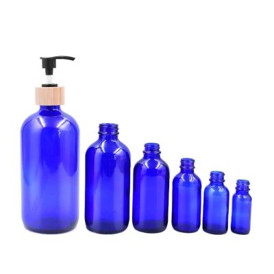 High quality 15ml 30ml 60ml 120ml 240ml 480ml blue boston beverage glass bottle for cosmetic with pump lid