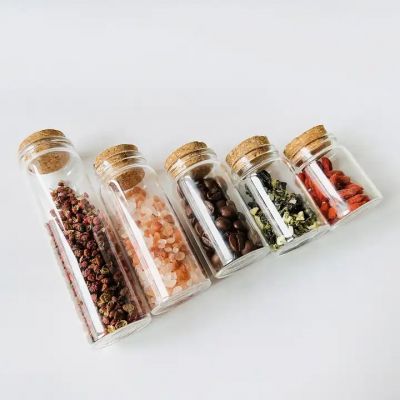 Different sizes small glass vials containers bottles with cork tops