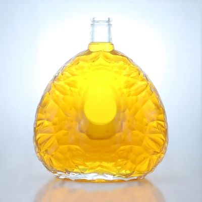 Luxury unique design embossed flat 700ml whiskey rum bottle spirits glass bottle with high quality