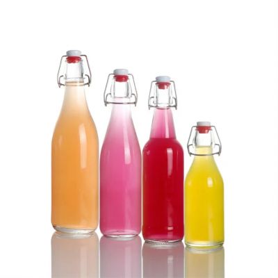 Stocked clear flip top glass bottle swing top 8oz 16oz glass juice bottle with cap